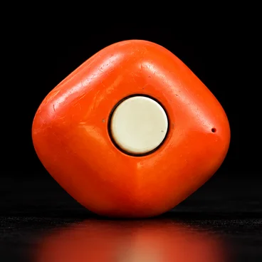goddo v1, the first prototype: an orange pebble with one big button